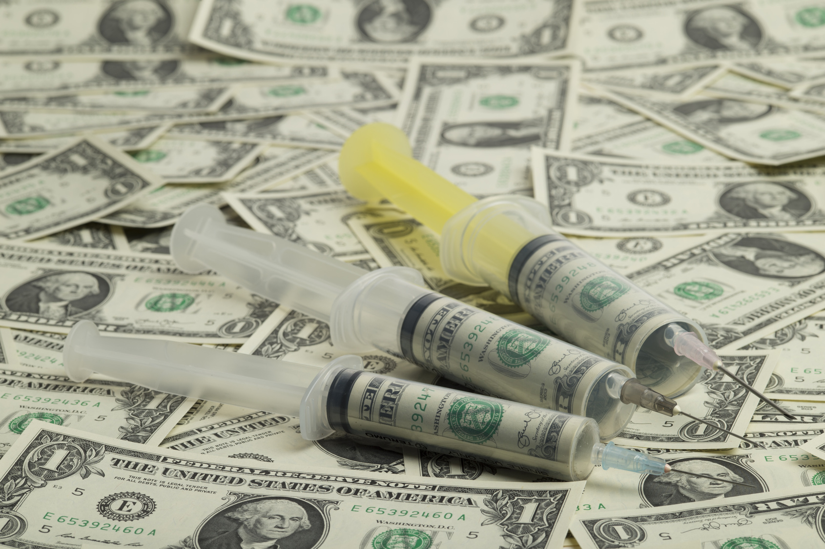 Syringe and money