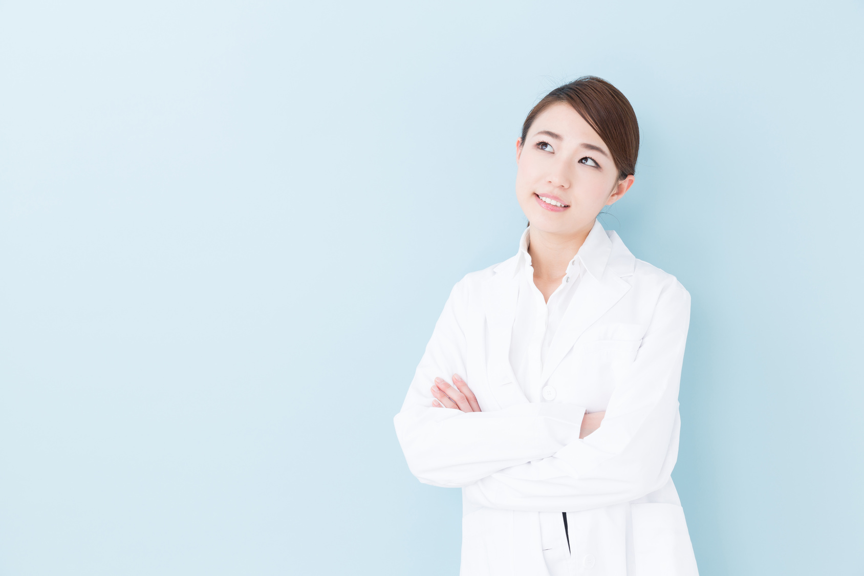 young asian doctor on blue background