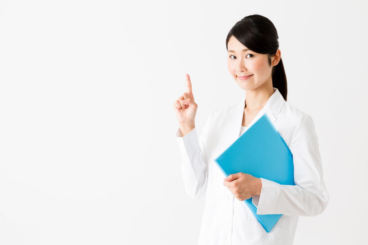 portrait of young asian doctor showing isolated on white background