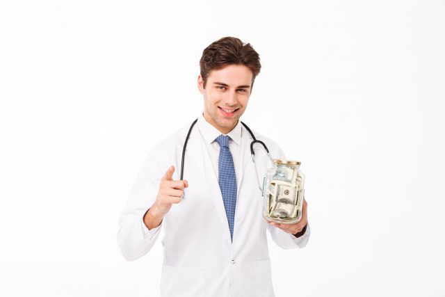 Portrait of a smiling happy male doctor dressed