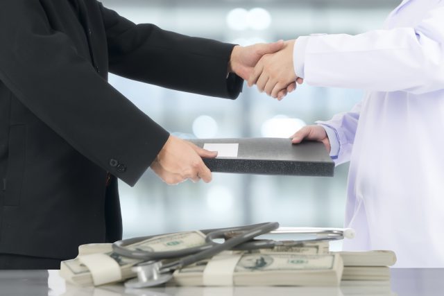 Businessman handshake to deal with the doctor.