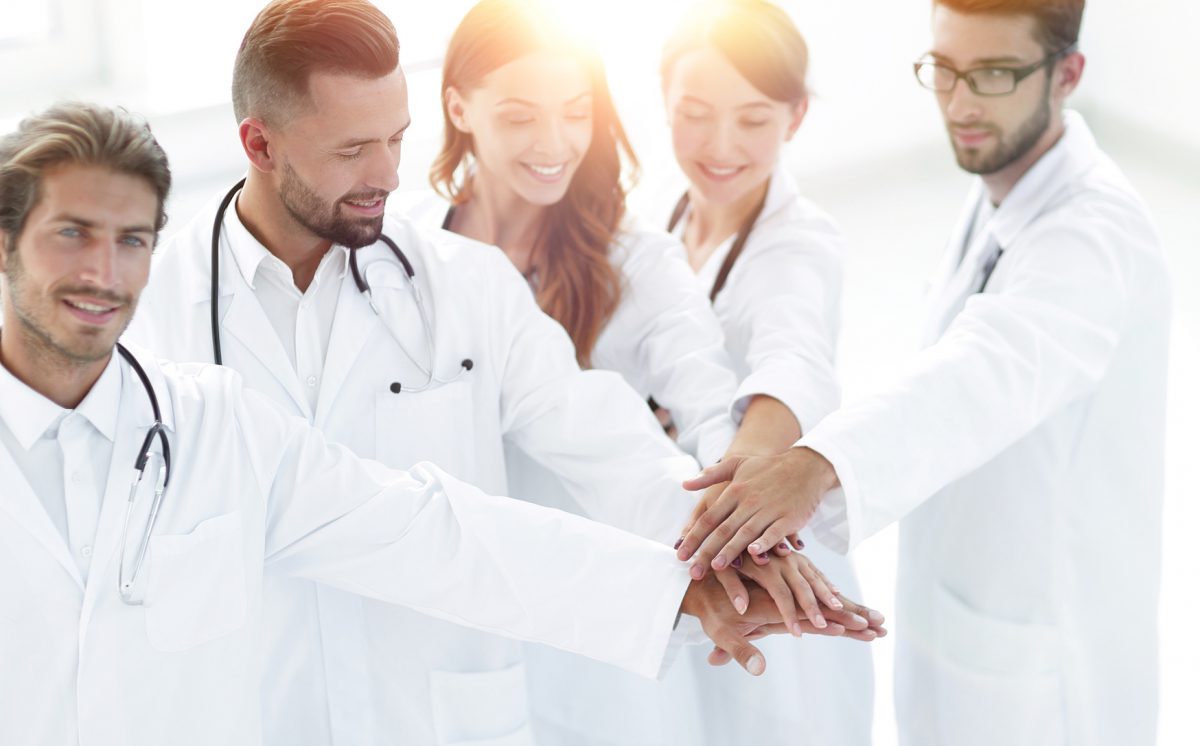 Joyful doctors are proud of their teamwork