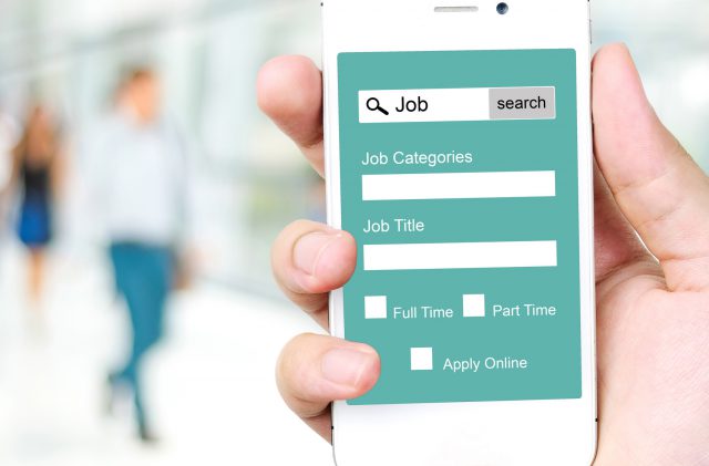 Job search on smart phone screen over blur office and people background, business concept